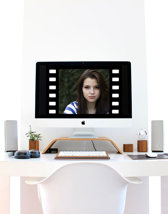 Video Editing Workstation with Woman on Screen